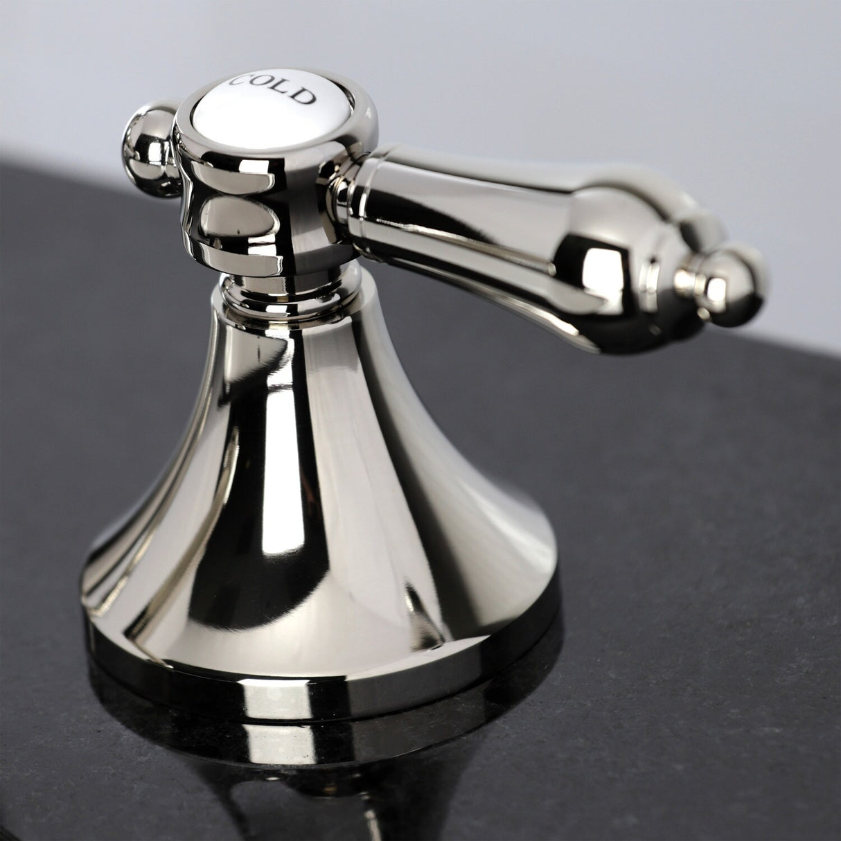 Kingston Brass Heirloom Deck Mount Widespread Bathroom Faucet with Brass Pop-Up