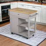 Homeroots Gray and Natural 35" Rolling Kitchen Island With Storage