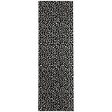 LEOPARD WHITE ON BLACK Area Rug by Marina Gutierrez
