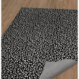 LEOPARD WHITE ON BLACK Area Rug by Marina Gutierrez