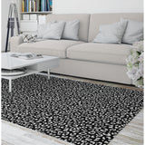 LEOPARD WHITE ON BLACK Area Rug by Marina Gutierrez