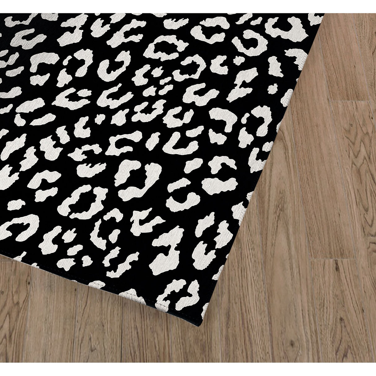 LEOPARD WHITE ON BLACK Area Rug by Marina Gutierrez