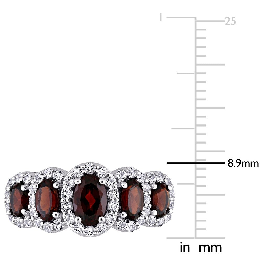 Miadora 10k White Gold Oval-cut Garnet and White Topaz 5-Stone Halo Ring
