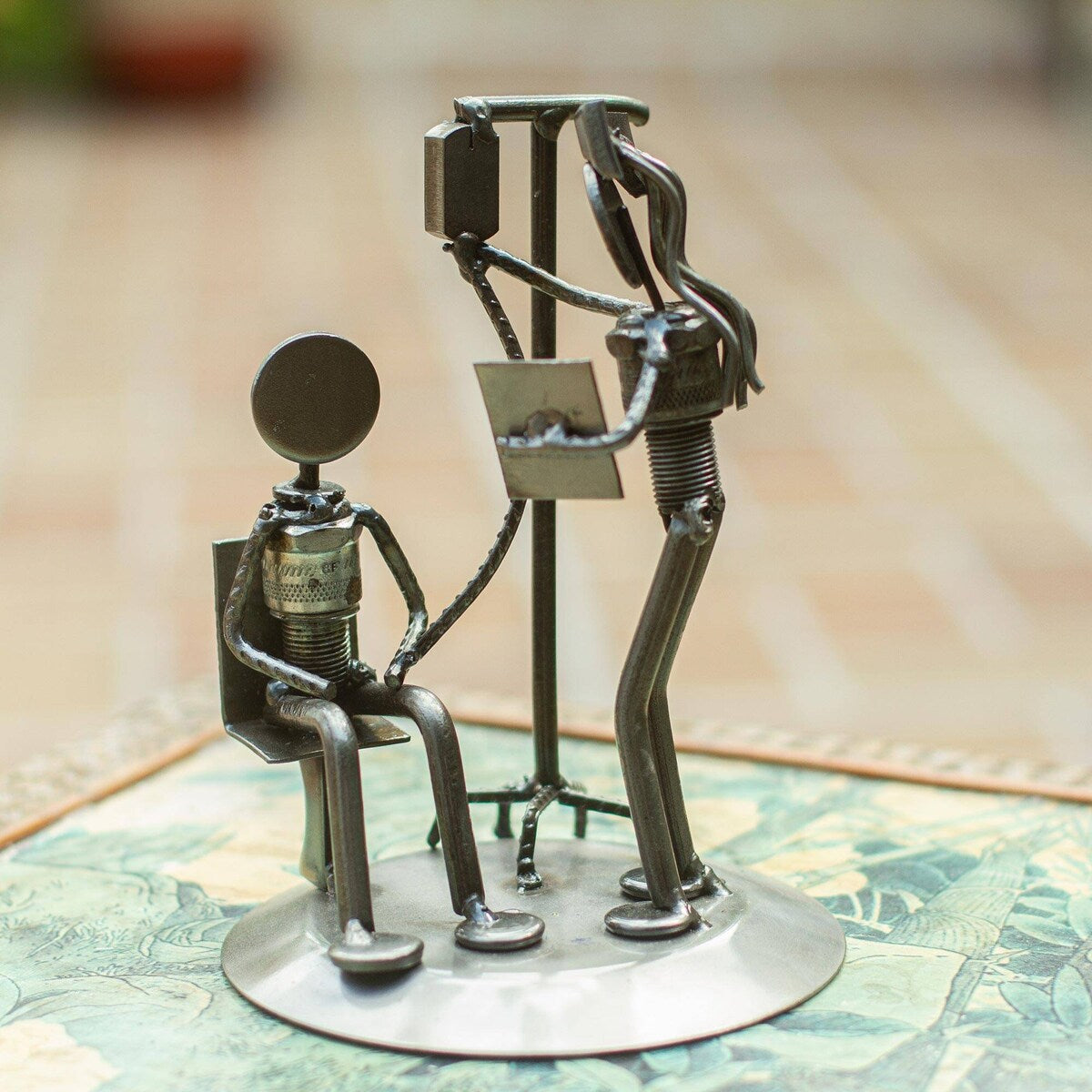 NOVICA Rustic Infusion Nurse, Recycled auto parts sculpture