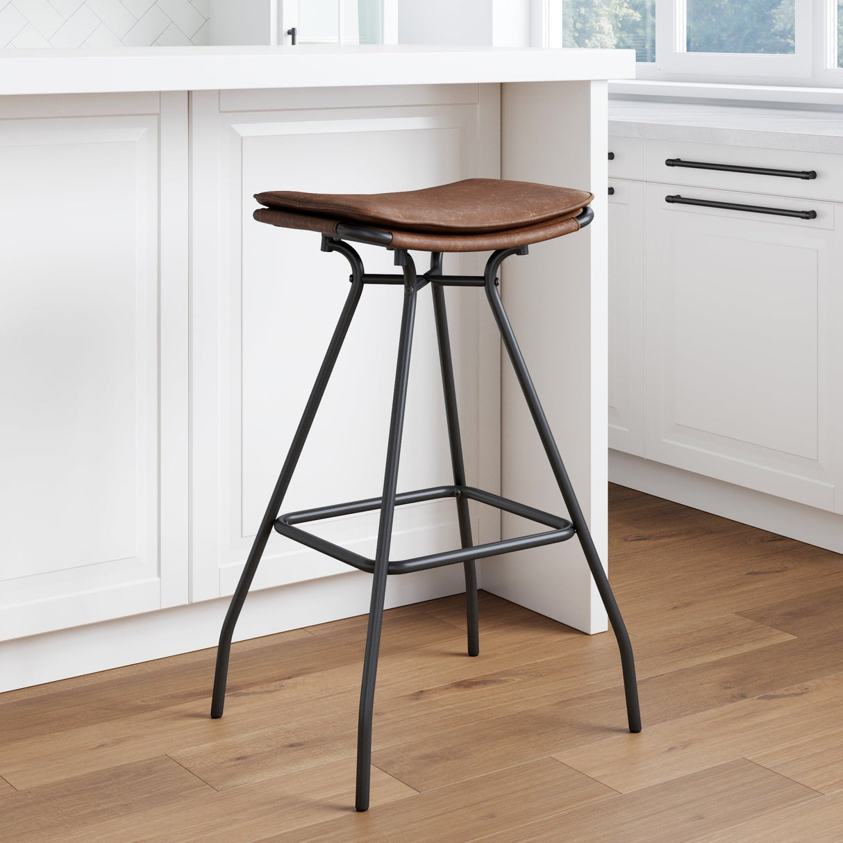 Nathan James Dominique Industrial Backless Kitchen Bar Stool with Brown Leather Saddle Seat and Metal Base