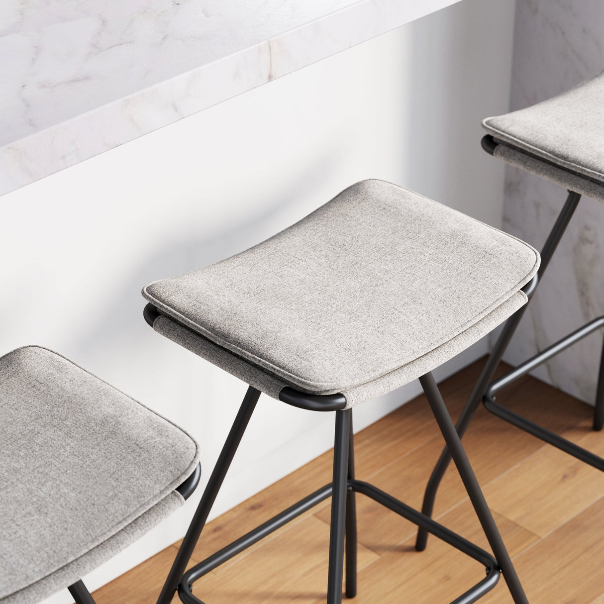 Nathan James Dominique Industrial Backless Kitchen Bar Stool with Brown Leather Saddle Seat and Metal Base