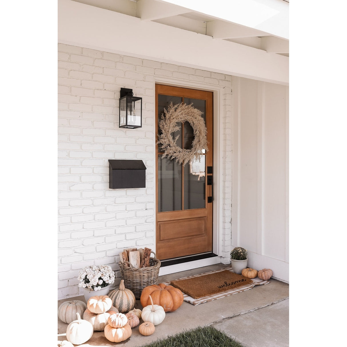 Nathan James Ferris Outdoor Black Wall Sconce Light Fixture with Iron Frame and Glass