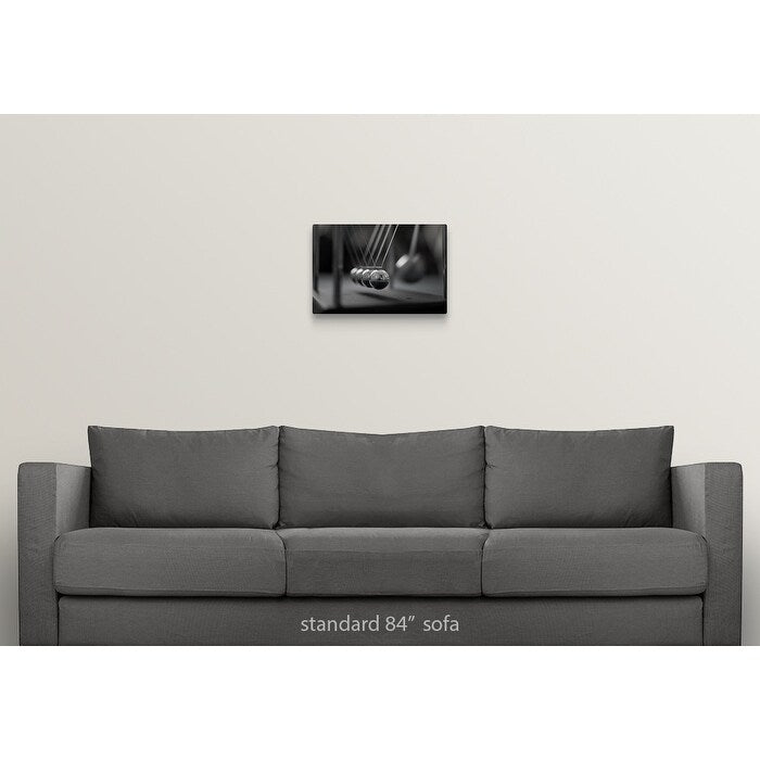 "Newton's Cradle in Motion" Canvas Wall Art