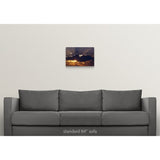 "Sun rising behind dark clouds, Montana" Canvas Wall Art