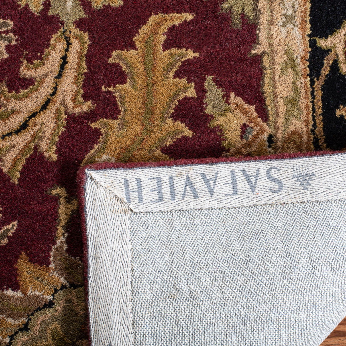 SAFAVIEH Handmade Heritage Lion Traditional Oriental Wool Rug