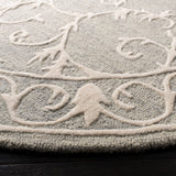 SAFAVIEH Handmade Micro-Loop Tomke Wool Rug