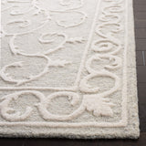 SAFAVIEH Handmade Micro-Loop Tomke Wool Rug