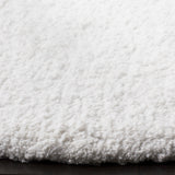 SAFAVIEH Handmade Sheep Shag Dochia Solid Polyester Rug