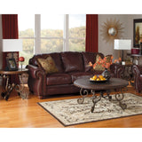 Signature Design by Ashley Rafferty Round Dark Brown End Table