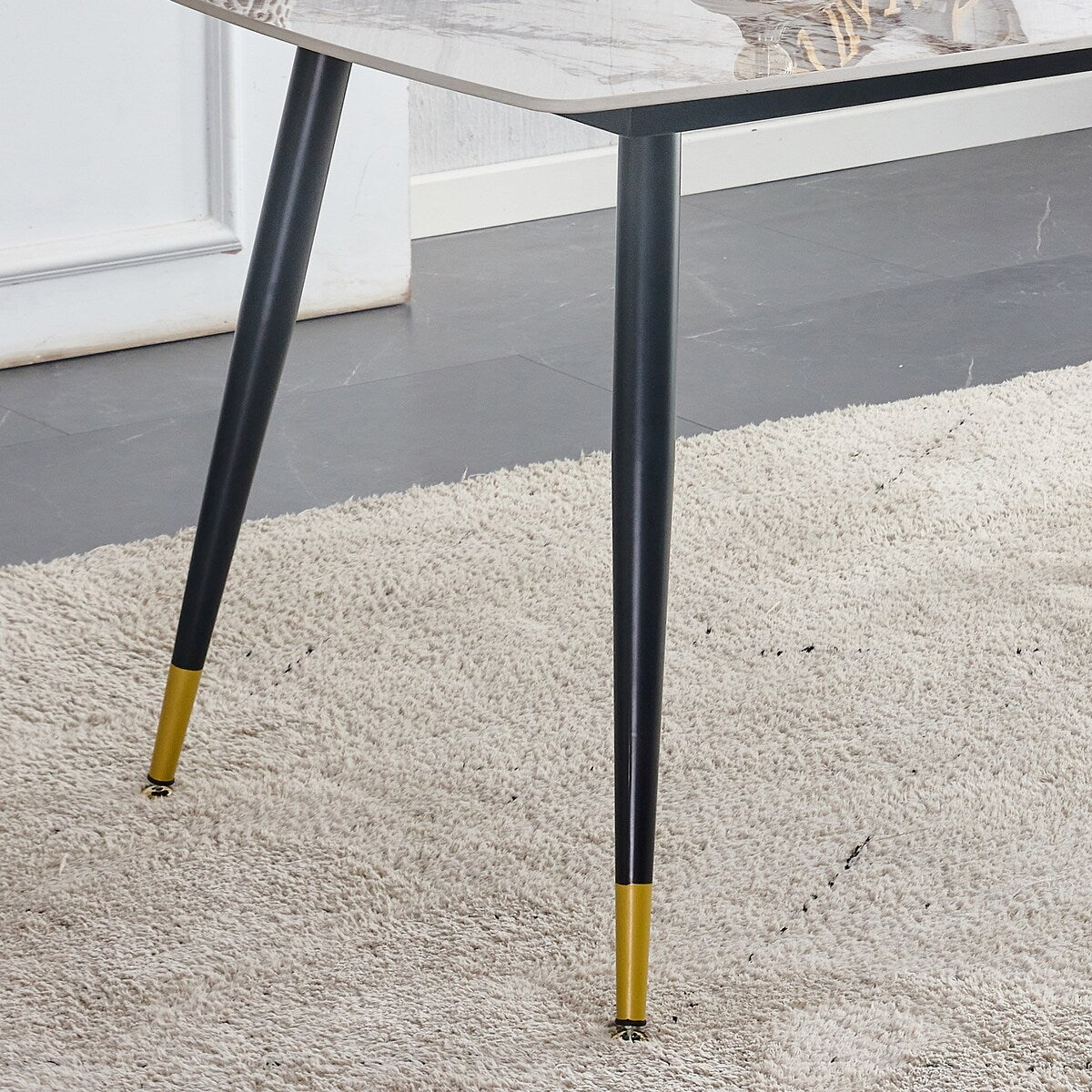 Table and chair set. Black sintered stone tabletop with black metal legs