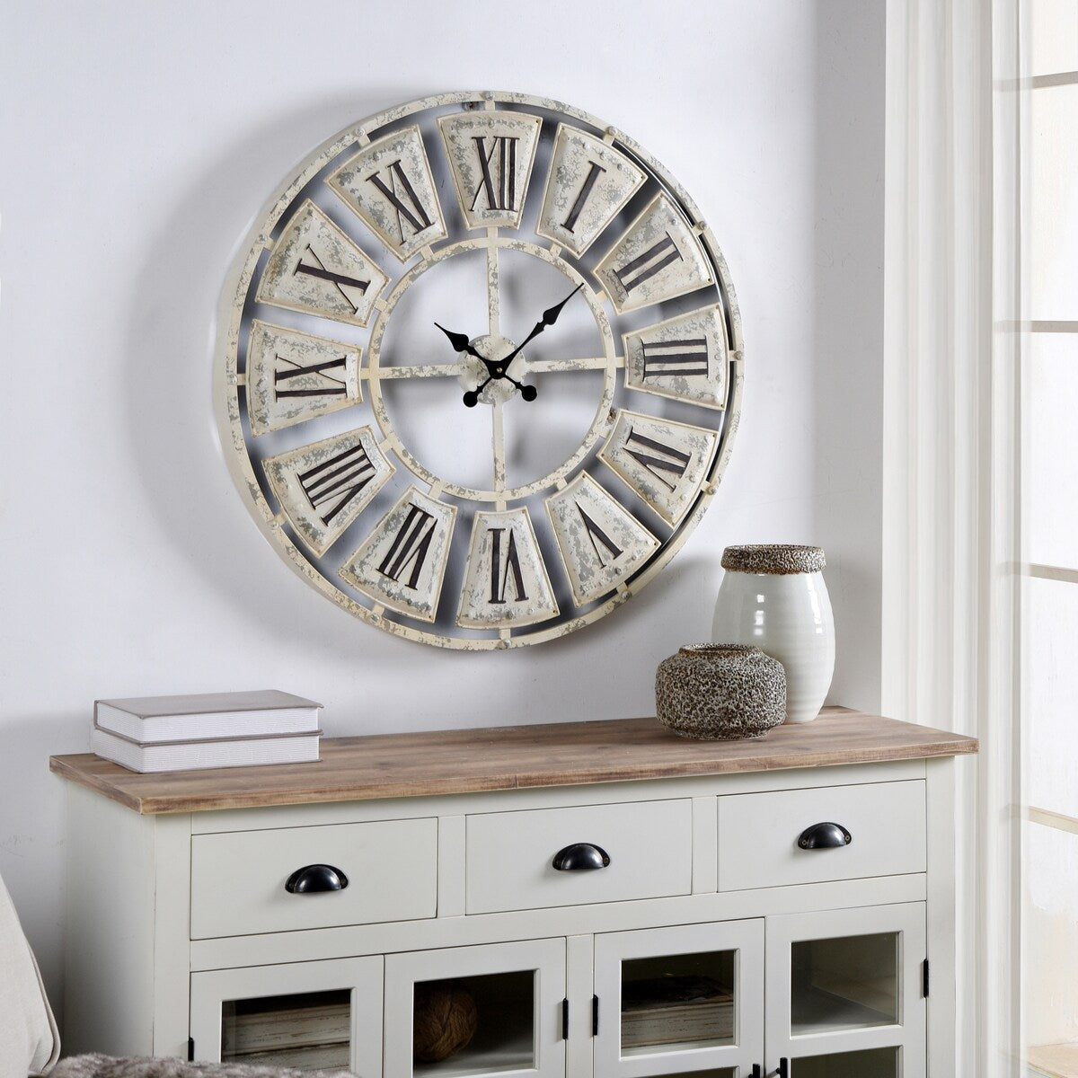 The Gray Barn Round Wall Clock with Roman Numerals on-light Weathered Face