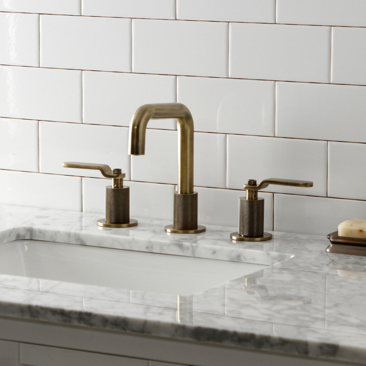 Kingston Brass Whitaker Two-Handle 3-Hole Deck Mount Widespread Bathroom Faucet with Push Pop-Up