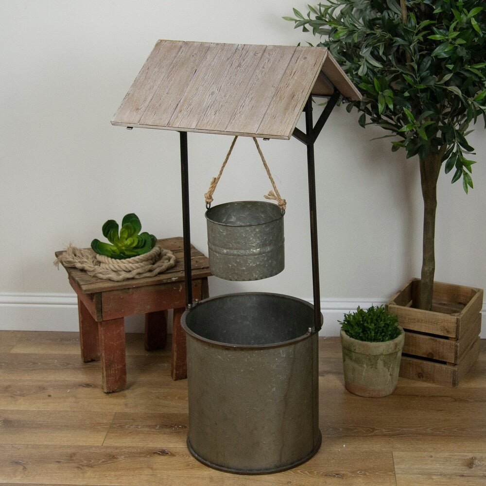 Wooden metal well sculpture